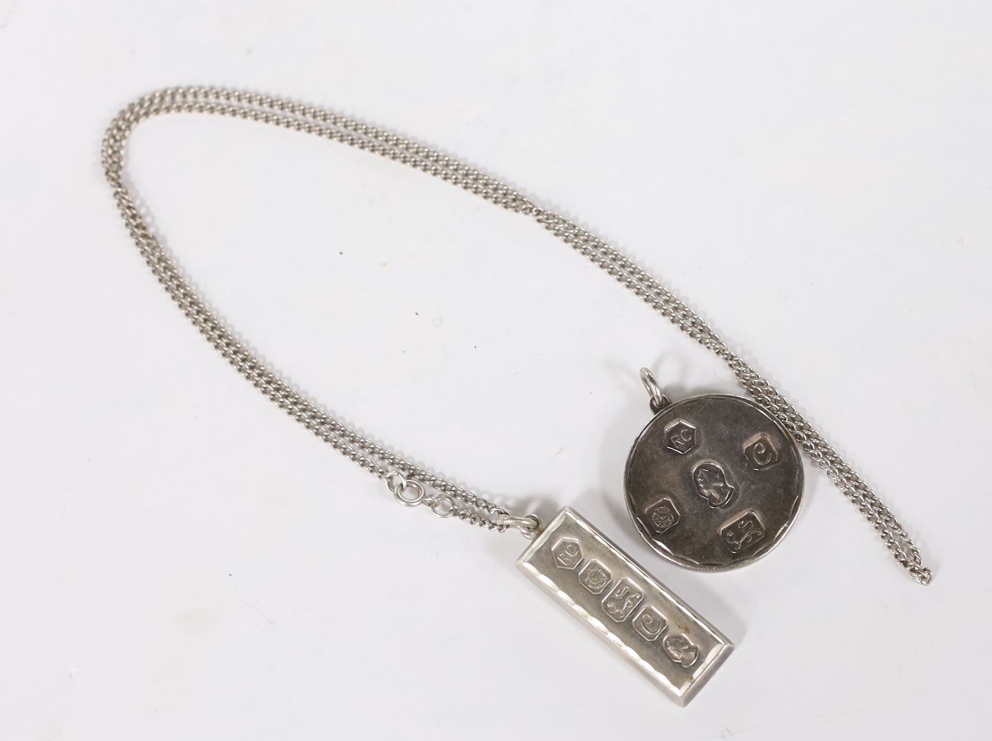 Two 1970's silver pendants, including ingot on a sterling chain, 40mm.